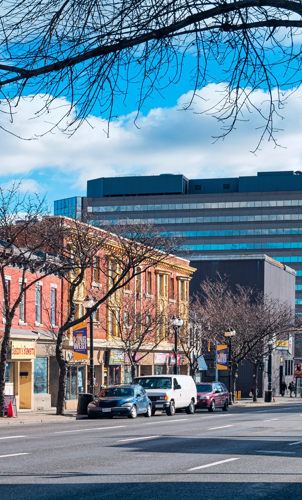 A residential Ontario street lined with townhouses.